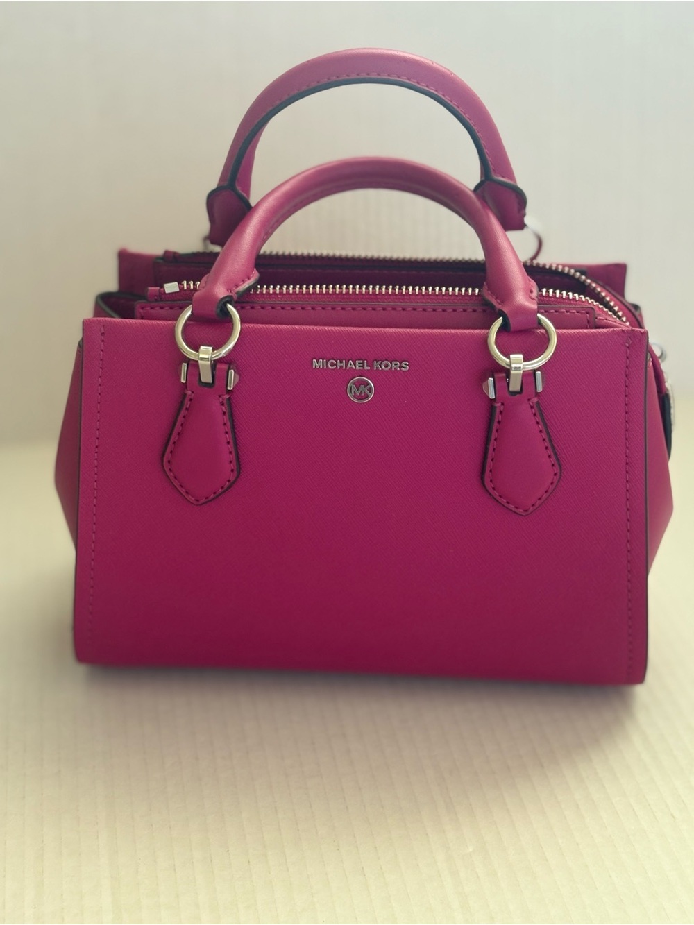 Michael Kors Marilyn Vibrant Pink Small Crossbody Bag crafted Saffiano Leather.